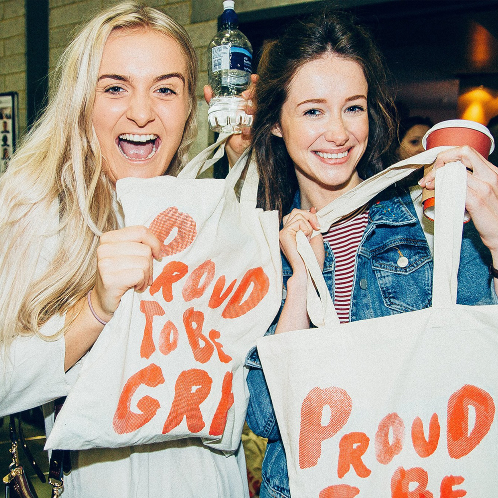 Students from Greenwich with merchandise bags