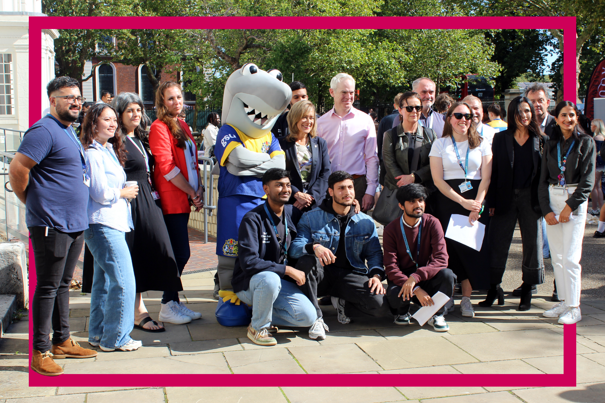 University and Union staff posed with Cutty shark mascot outside of dreadnought building in Greenwich