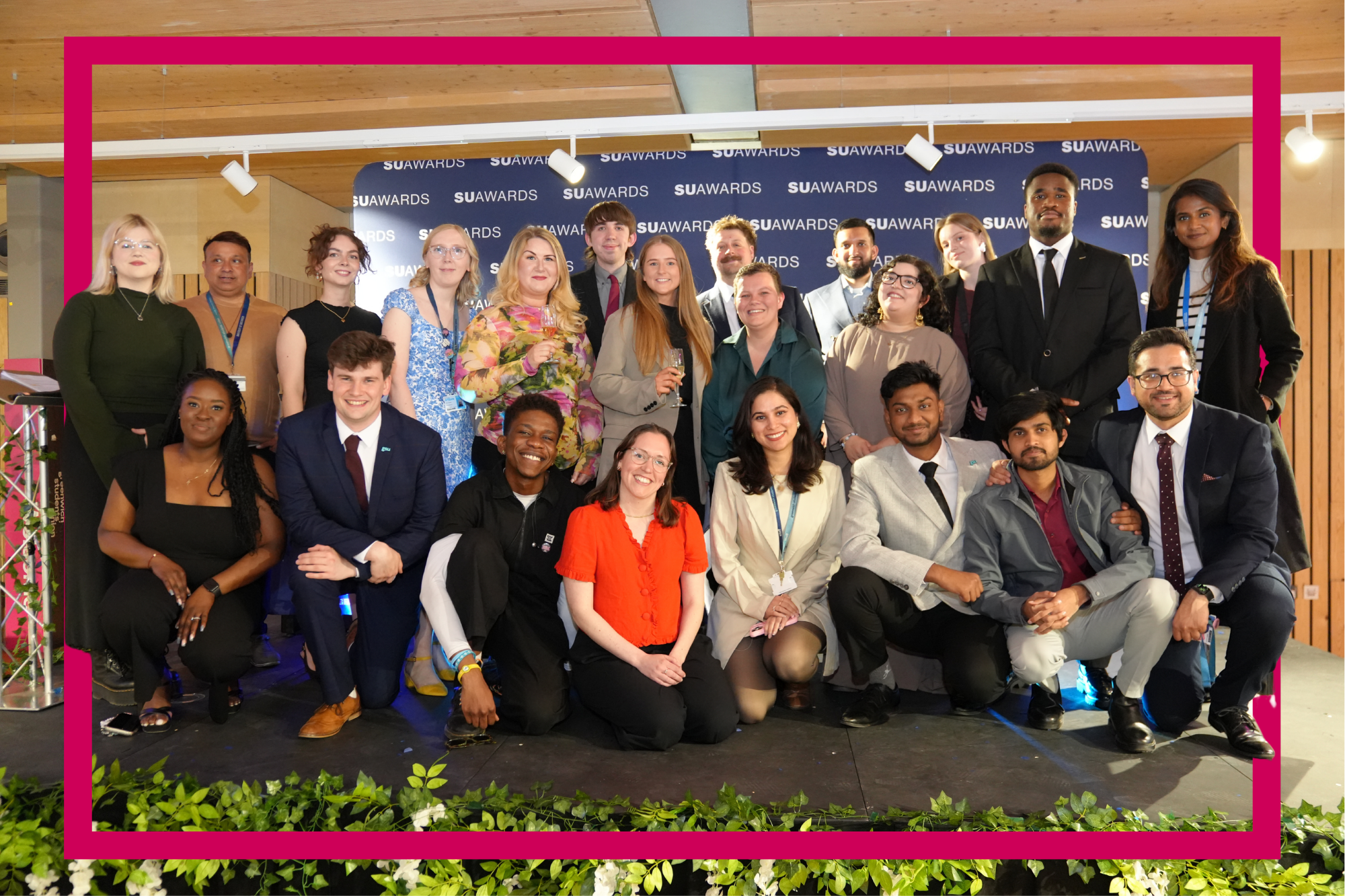 Greenwich Students' Union staff on stage at SUAwards posing
