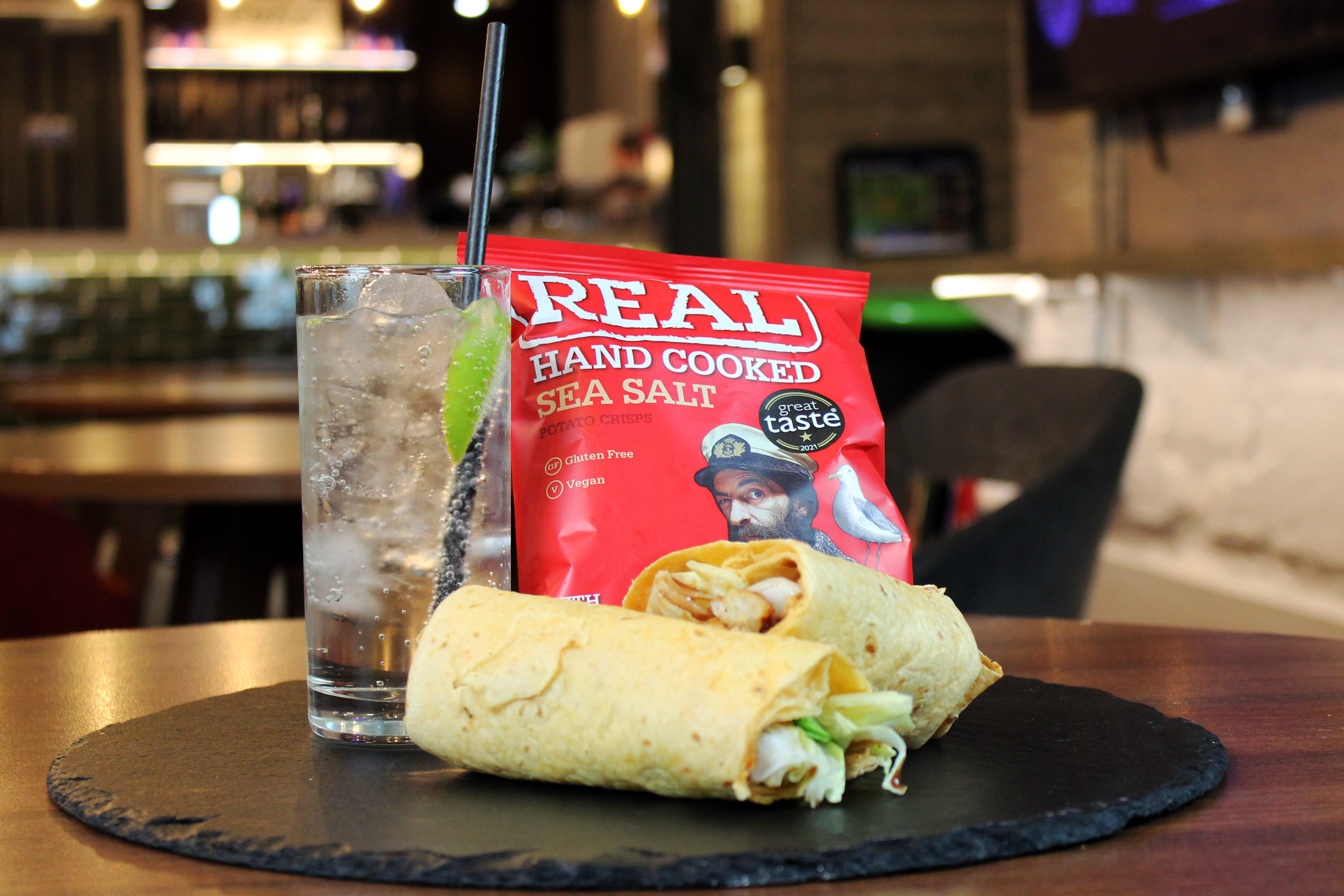 wrap with a drink and bag of crisps