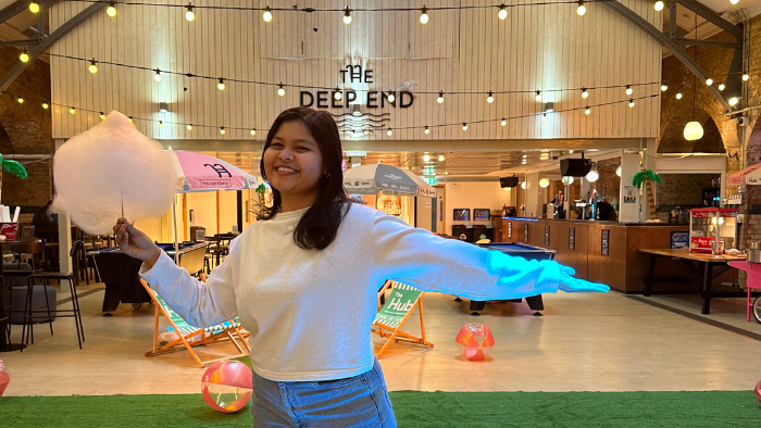 Student in The Deep End bar happy candyfloss